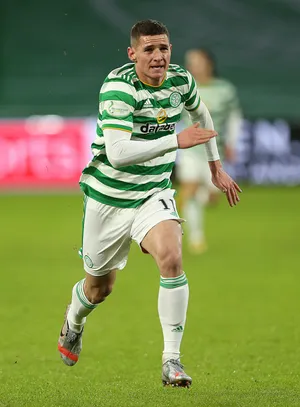 Soccer Playerin Action Green White Stripes Wallpaper