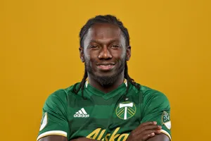 Soccer Playerin Green Jersey Portrait Wallpaper