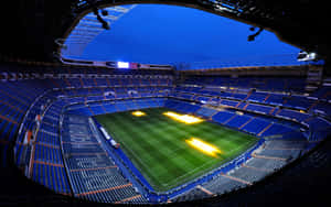 Soccer Players Competing At A Packed Soccer Stadium Wallpaper