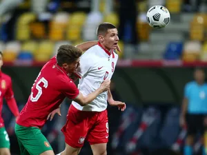 Soccer Players Competing For Ball Wallpaper