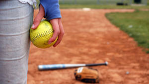 Softball Photograph On Hand Wallpaper