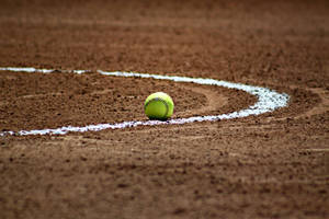 Softball Surrounded By White Curved Line Wallpaper