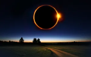 Solar Eclipse Over Country Road Wallpaper