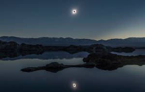 Solar Eclipse Over Scottish Loch Wallpaper