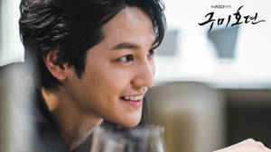 South Korean Actor Kim Bum Displaying A Playful Smile. Wallpaper