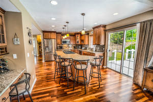 Spacious Kitchen With Wooden Tiled Floor Wallpaper