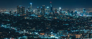 Spectacular Night View Of City Skyline In 2560x1080 Resolution. Wallpaper