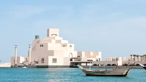 Spectacular View Of Boats Approaching The Museum Of Islamic Art Wallpaper
