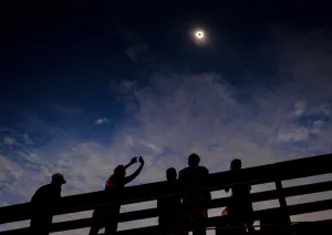 Spectacular View Of Solar Eclipse Enjoyed By Crowd Wallpaper