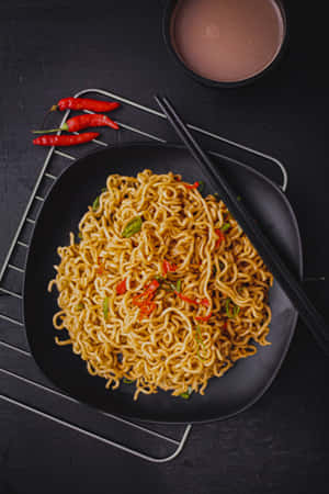 Spicy Schezwan Vegetable Noodles With Sauce Wallpaper