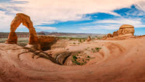 Spiraling Crater By The Arch Wallpaper