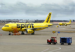 Spirit Airlines Plane And Airport Tractor Wallpaper