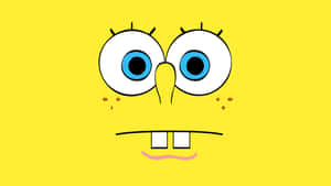 Spongebob Squarepants Face With Blue Eyes On Yellow Background Wallpaper