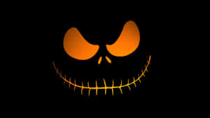 Spooky Halloween Skeleton With Glowing Eyes Wallpaper