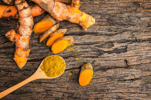 Spoon Of Turmeric Powder Wallpaper