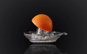 Squeeze Fresh Citrus Juice With Orange Citrus Juicer Wallpaper