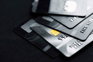 Stack Of Dark Colored Credit Cards Wallpaper