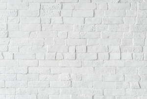 Stand Out From The Crowd With A Lopsided White Brick Wallpaper