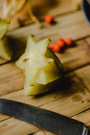 Star Fruit On Bamboo Table Wallpaper