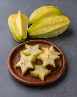 Star Fruit On The Gray Table Wallpaper