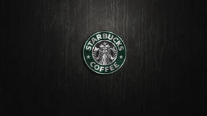 Starbucks Logo On Dark Background Wallpaper