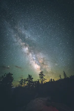 Stargazing On A Cosmic Night Wallpaper