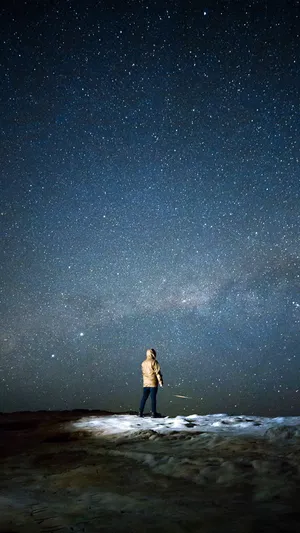 Stargazing Solitude Night Sky Wallpaper