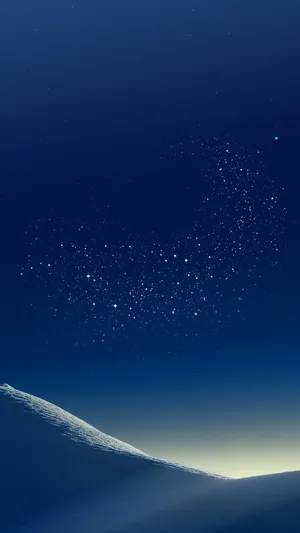 Starry Night Sky Over Snowy Hillside Wallpaper