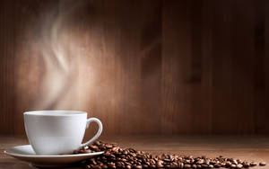 Steam Rising From A Freshly Brewed Cup Of Coffee Wallpaper