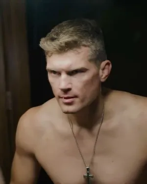 Stephen Thompson Delivering A Powerful Kick During A Martial Arts Competition Wallpaper