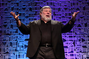 Steve Wozniak Raising Both Hands While Standing Wallpaper