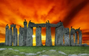 Stonehenge With Fiery Sky Background Wallpaper