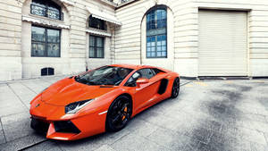 Streets Of London Lit Up By An Orange Lamborghini Aventador Wallpaper