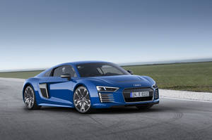 Striking Blue Audi R8 E-tron In Motion Wallpaper