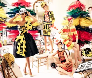 Striking Moschino Fashion Statement In Caution Tape Design Wallpaper