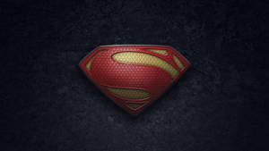 Striking Textured Superman Logo In Red And Yellow Wallpaper