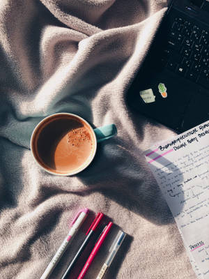 Studying On Bed Sheets Wallpaper