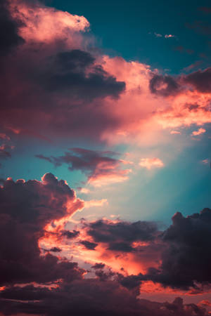 Stunning 4k Iphone Wallpaper Displaying Pink Clouds Wallpaper