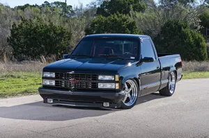 Stunning Black Dropped Truck In Minimalistic Style Wallpaper