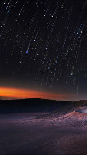 Stunning Meteor Shower In The Night Sky Wallpaper