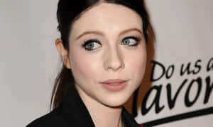 Stunning Michelle Trachtenberg Posing Elegantly In A Radiant Photoshoot Wallpaper