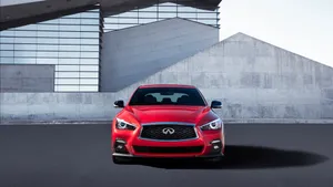 Stunning Red Infiniti Q50 On The Road Wallpaper
