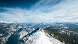 Stunning View Of Snowy Yosemite Mountain Wallpaper