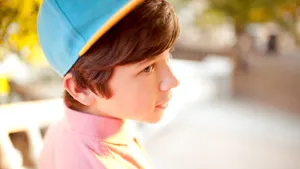 Stylish Boy With Cap Close Up Wallpaper