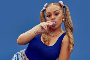 Stylish_ Woman_ Blowing_ Bubblegum Wallpaper