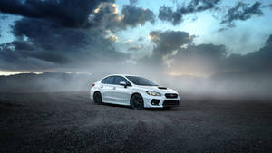 Subaru On Black Sand Gravel Wallpaper