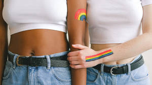 Subtle Lgbt Rainbow Tattoos On Bodies Wallpaper