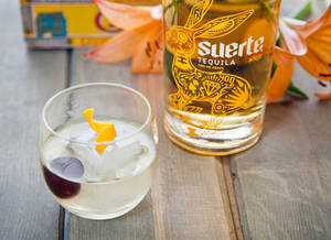 Suerte Anejo With An Orange Twist Wallpaper