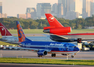 Sun Country Aircraft In Minneapolis Saint Paul Airport Wallpaper