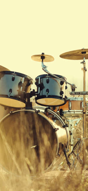 Sunlit Drum Set Outdoor Scene Wallpaper